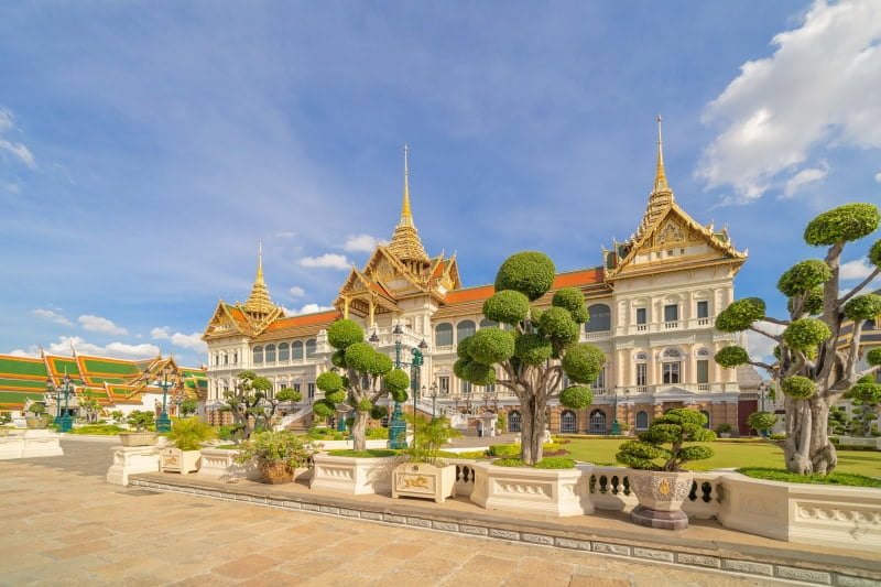 Golden pagoda at Temple of the Emerald Buddha in Bangkok, Thailand. Wat Phra Kaew and Grand palace in old town, urban city. Buddhist temple, Thai architecture. A tourist attraction