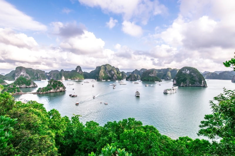 Ha Long Bay, the limestone mountains with blue sky and green trees, is UNESCO World Heritage Site and popular travel destination in Quang Ninh Province, nearby Hanoi, Vietnam