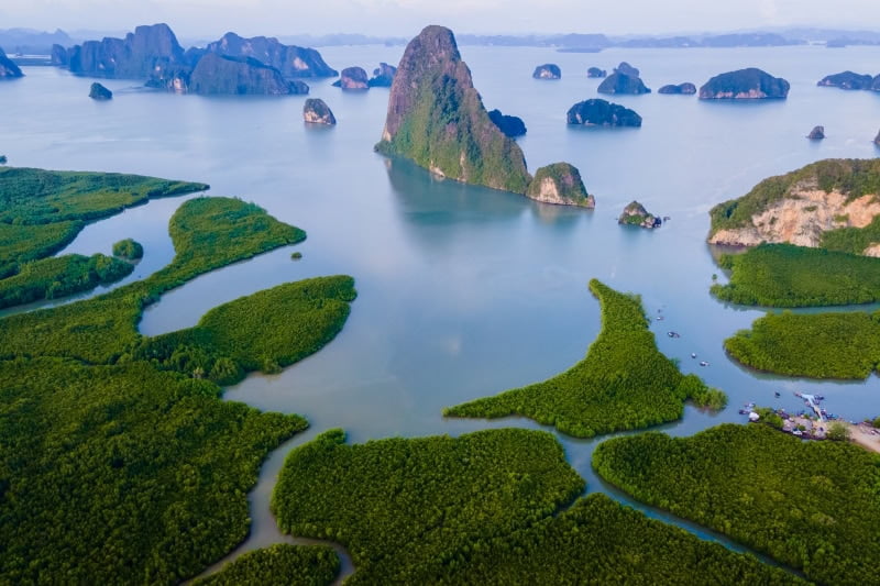 Sametnangshe, view of mountains in Phangnga Bay with mangrove forest in the Andaman Sea with evening twilight sky, travel destination in Phangnga, Thailand
