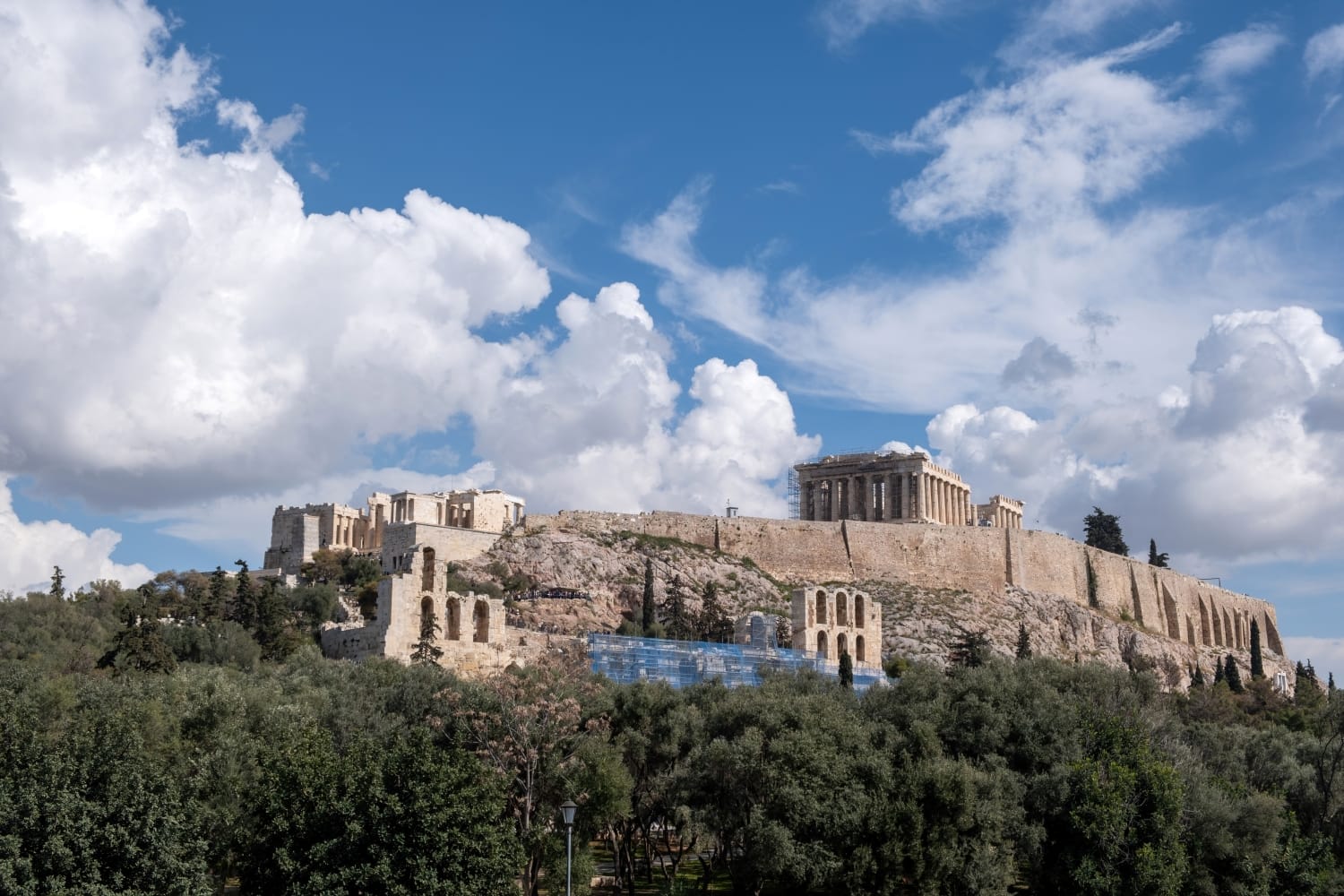 Athens, Greece Archeological destination. Acropolis and Parthenon temple under cloudy sky background. View of ancient Greece from Philopappos Hill.